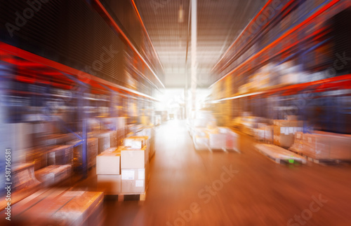 Blurred Warehouse Space. Tall Shelf Storage Warehouse. Package Boxes Supplies. Supply Chain Shipment Goods. Distribution Shipping Warehouse Logistics	
