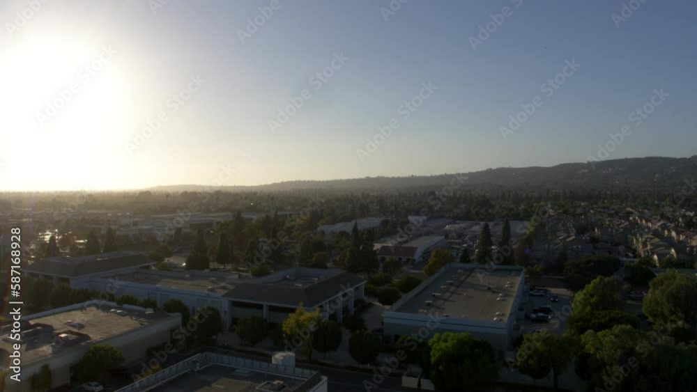 Aerial Downward Shot Of Structures Amidst Trees On City Landscape Against Clear Sky During Sunset - Camarillo, California Aerial Downward Shot Of Structures Amidst Trees On City Landscape Against Clear Sky During Sunset - Camarillo, California