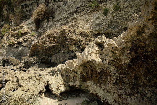 Rough white rocks from Suluban beach on Bali in Indonesia. photo