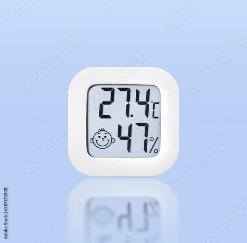 Thermometer and humidity instrument isolated on blue background with reflection, Clipping path included. photo