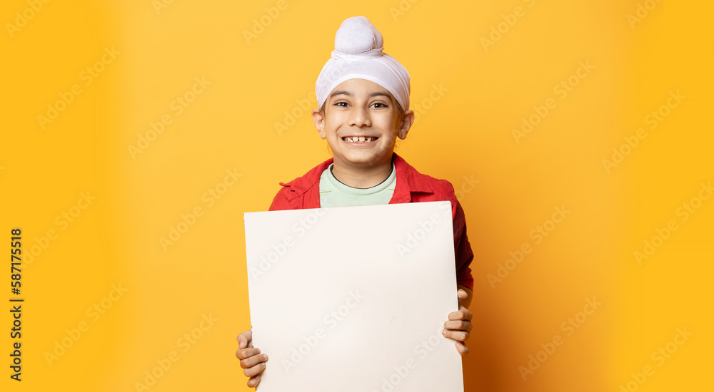 indian Sikh turban kid with sign board in hand indian Sikh turban kid with sign board in hand