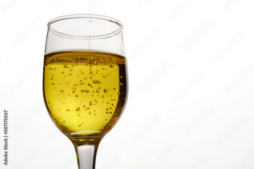 crystal glass with virgin olive oil falling down crystal glass with virgin olive oil falling down
