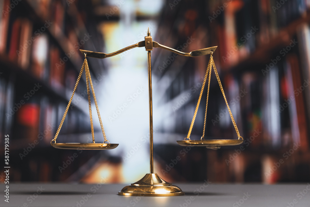Shiny golden balanced scale in court library background as concept ...
