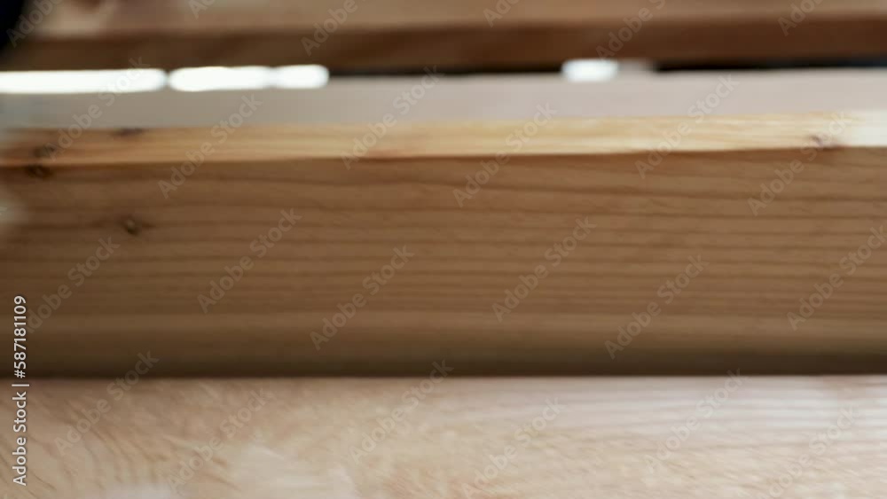 Precision in Craftsmanship A Close-Up of a Finish Carpenter Expert Hand on Natural Cedar Boards Precision in Craftsmanship A Close-Up of a Finish Carpenter Expert Hand on Natural Cedar Boards