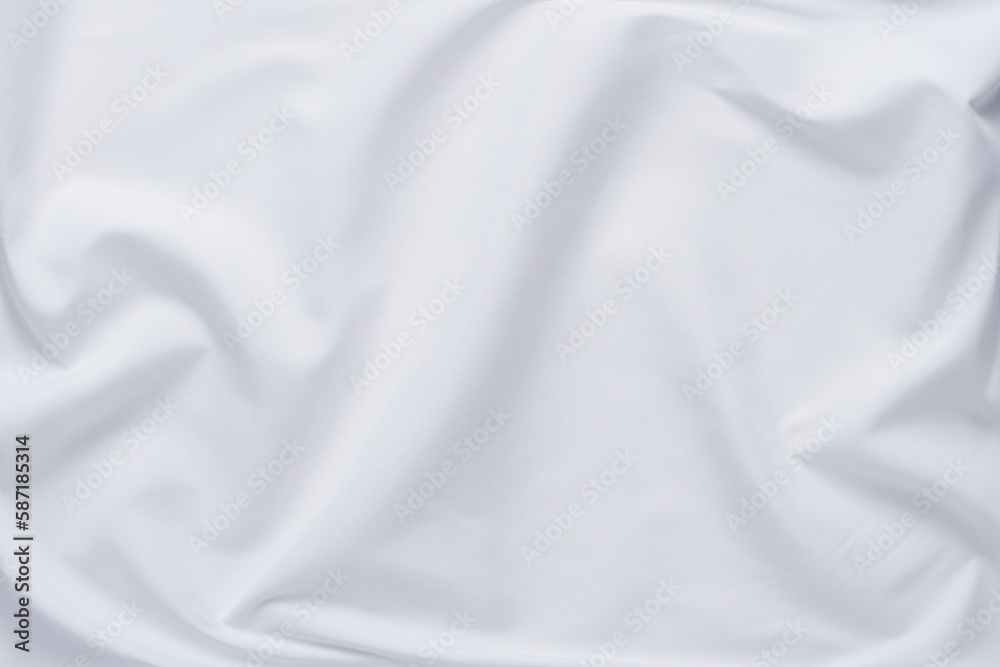 White fabric. luxurious white fabric texture background. Creases of satin, silk and cotton.