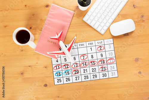 Planner Calendar and agenda reminders  work from home.  for plan daily meeting and note holiday trip in diary at office desk. 2023 calendar reminder concept.