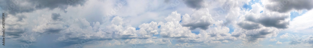 The panoramic view of the dark gray clouds contrasting with the blue sky was like a painting come to life, Sky background.