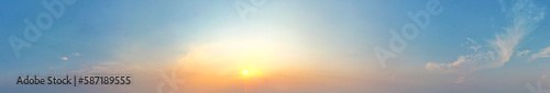 The orange cloud in the panorama seemed to be illuminated by the magical light of the sunset, Sky background.