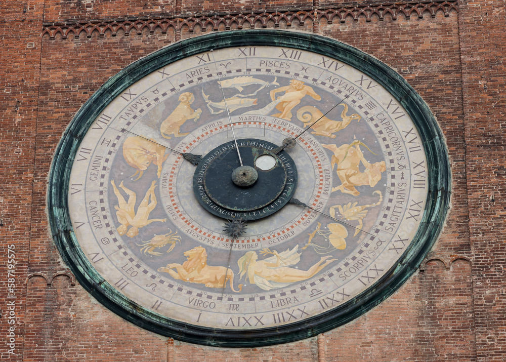 Clock on the Medieval Bell Tower of Cremona known as the Torrazzo, Lombardy, Italy.