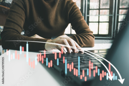 Investor analyze stock chart with laptop, businessman forecast and analysis graph in Bearish downtrend, economic slowdown, inflation crisis, loan interest rise, trade war finance, covid-19 impact.