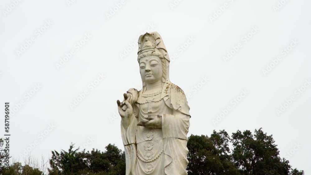 Tall Buddhism Statue in secret garden Tall Buddhism Statue in secret garden