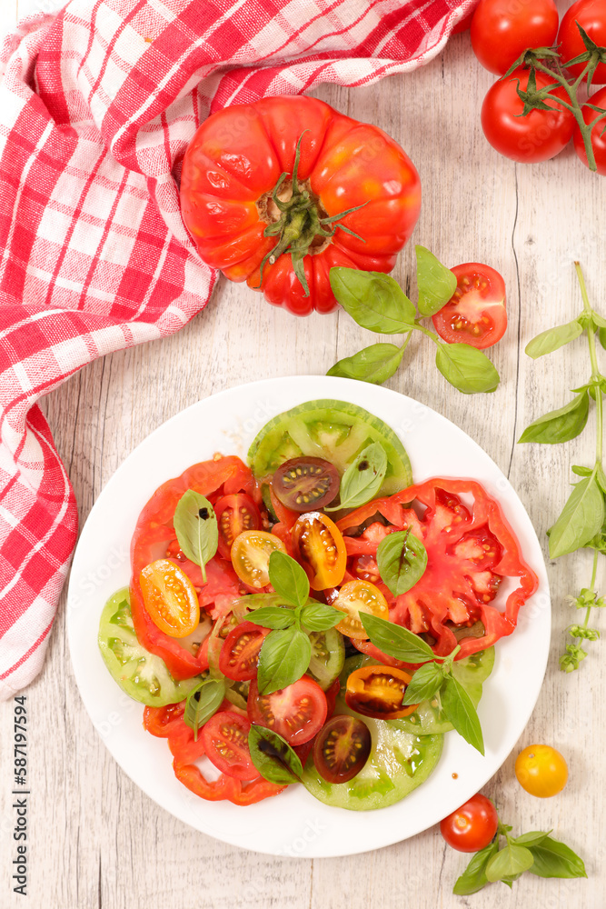 Healthy tomatoes salad with sauce and basil Healthy tomatoes salad with sauce and basil