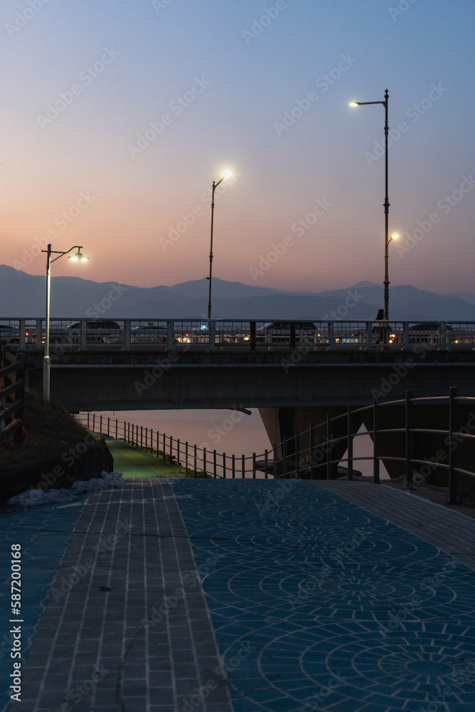 Chuncheon view of Soyang 2 bridge over Soyang river during winter evening and night at Chuncheon , South Korea : 11 February 2023