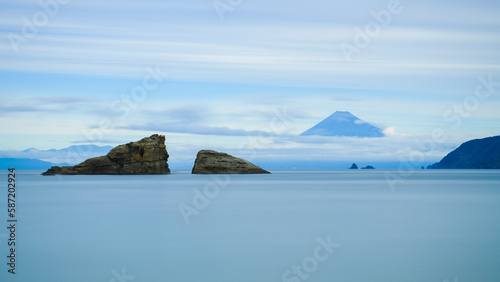 Long exposure shot of sea stacks in the water and Mount Fuji photo