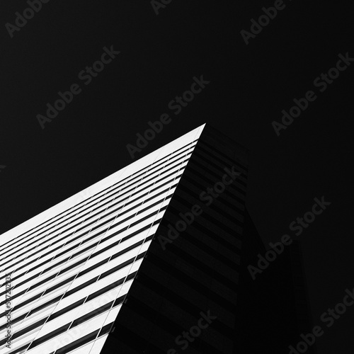 Low key dark shot of office building in Tokyo, Japan photo