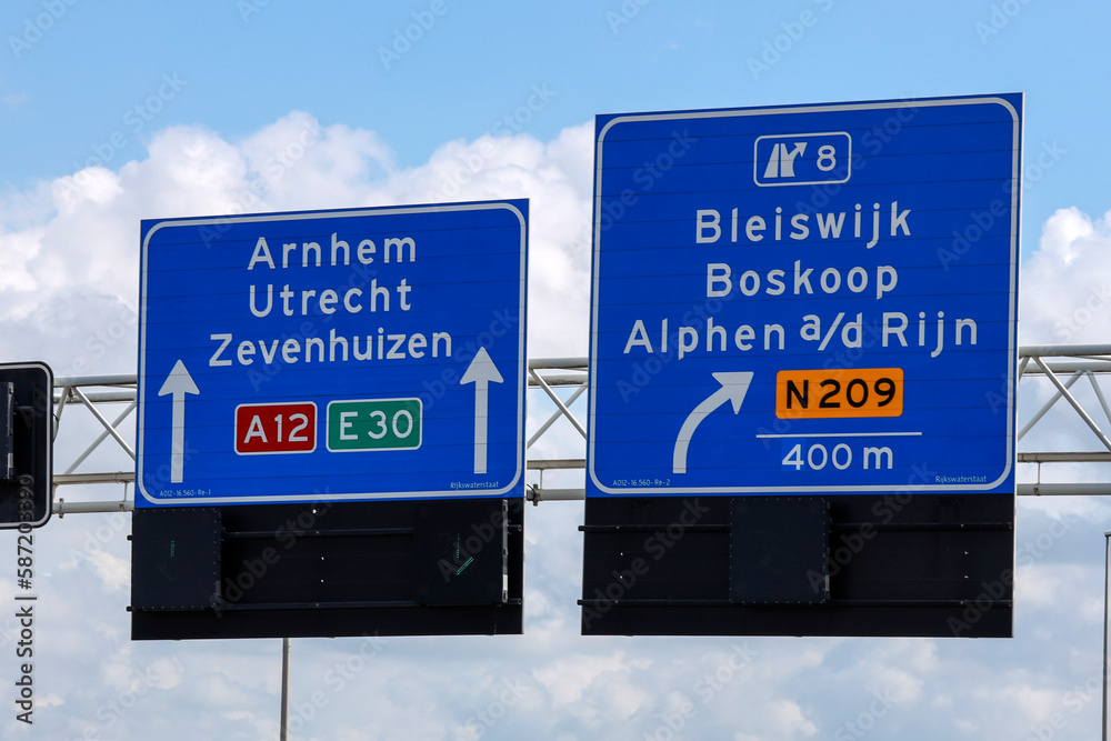 Dutch highway direction sign in blue and white  heading utrecht and bleiswijk