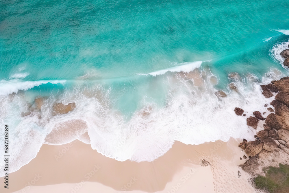 drone view of beach with waves and turquoise water