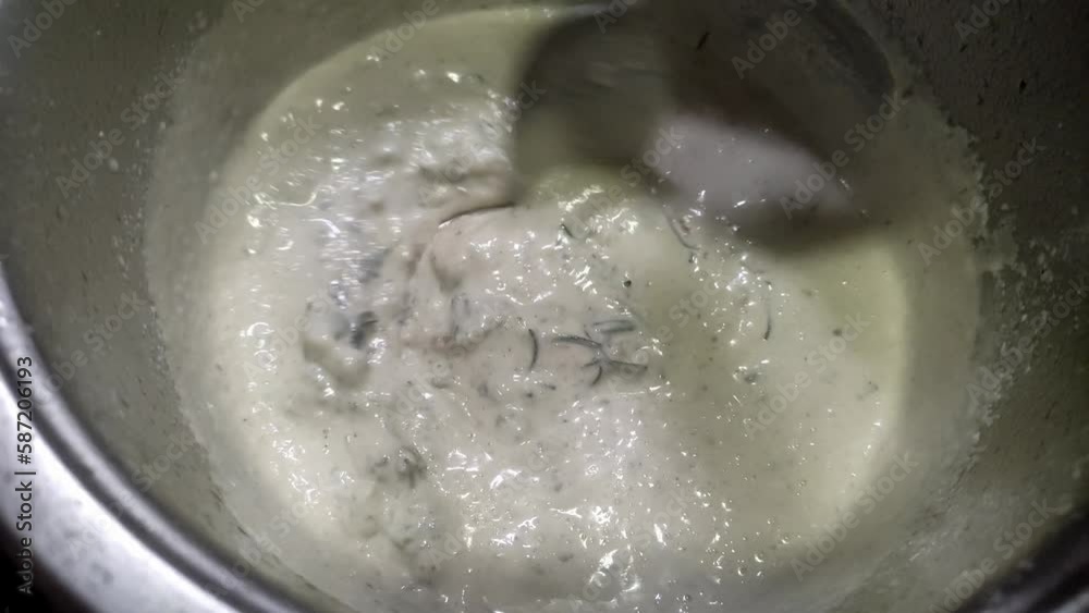 Chef prepares cream and blue cheese sauce Chef prepares cream and blue cheese sauce