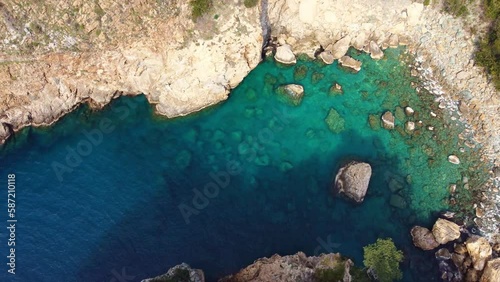 Aerial view of turquoise clear water in a small bay.  photo