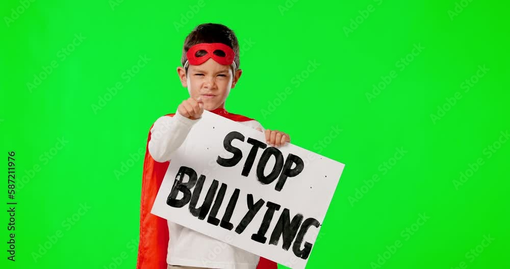 Superhero, stop bullying and boy with sign, green screen and costume against a studio background. Portrait, male child and young person with mask, face and protest for opinion for human rights Superhero, stop bullying and boy with sign, green screen and costume against a studio background. Portrait, male child and young person with mask, face and protest for opinion for human rights