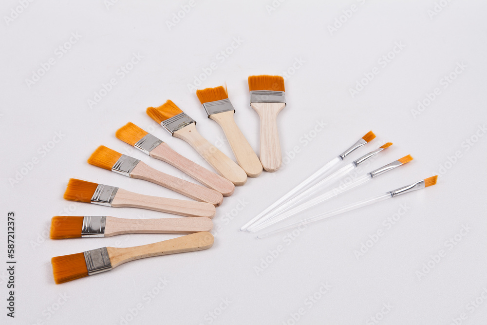 Several small paint brushes were placed on a white background to facilitate background removal Several small paint brushes were placed on a white background to facilitate background removal