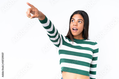 Young African American woman isolated on white background pointing away