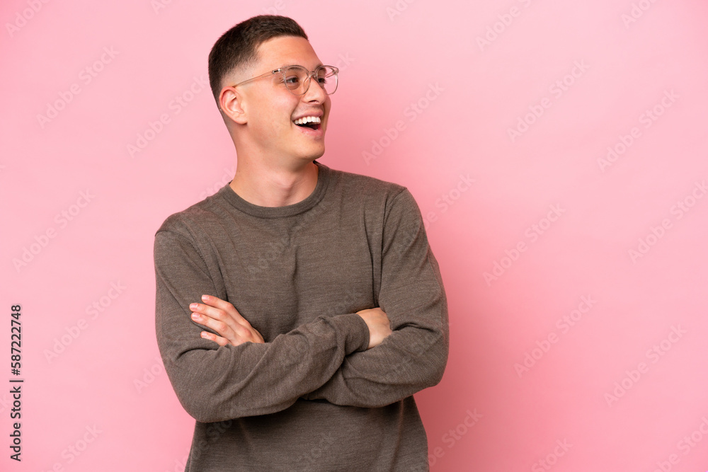 Young Brazilian man isolated on pink background happy and smiling Young Brazilian man isolated on pink background happy and smiling