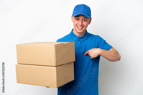 Young delivery Brazilian man isolated ops white background with surprise facial expression © luismolinero