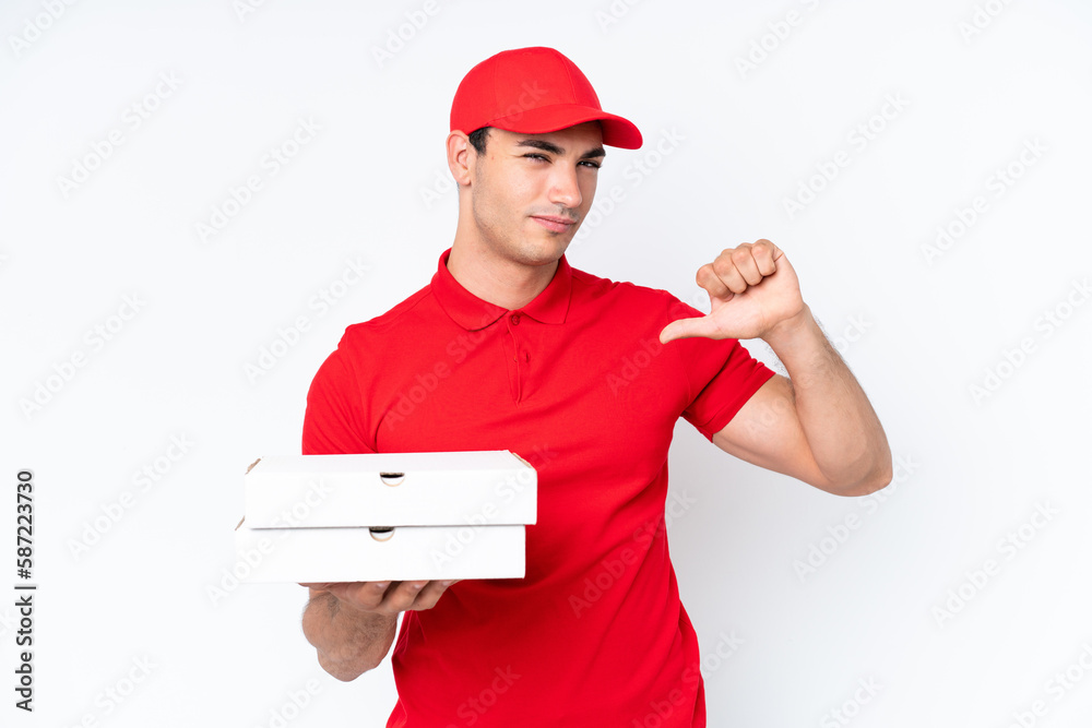 Pizza delivery caucasian man with work uniform picking up pizza boxes isolated on white background proud and self-satisfied Pizza delivery caucasian man with work uniform picking up pizza boxes isolated on white background proud and self-satisfied