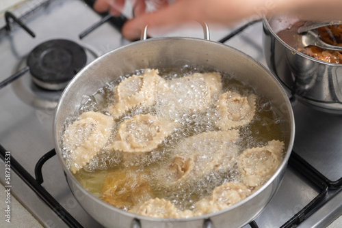 The magic of frying unfolds as chebakia takes a flavorful plunge into the hot oil, creating a crispy, golden exterior.