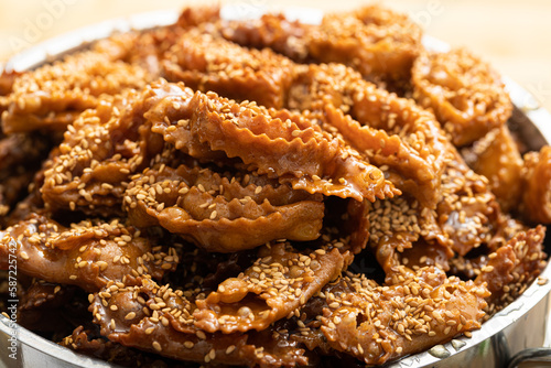 Close-up photo of a plate of chebakia, a delicious Moroccan pastry photo