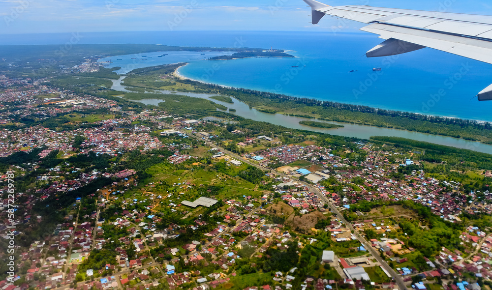 aerial view of the Bengkulu city landscape with the sea and sky in the background