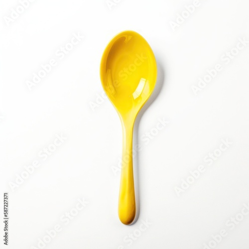 yellow plastic spoon isolated on white background © Thibaut Design Prod.