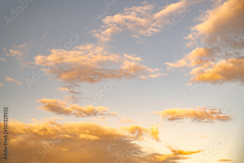 White clouds with yellow sunset light sky