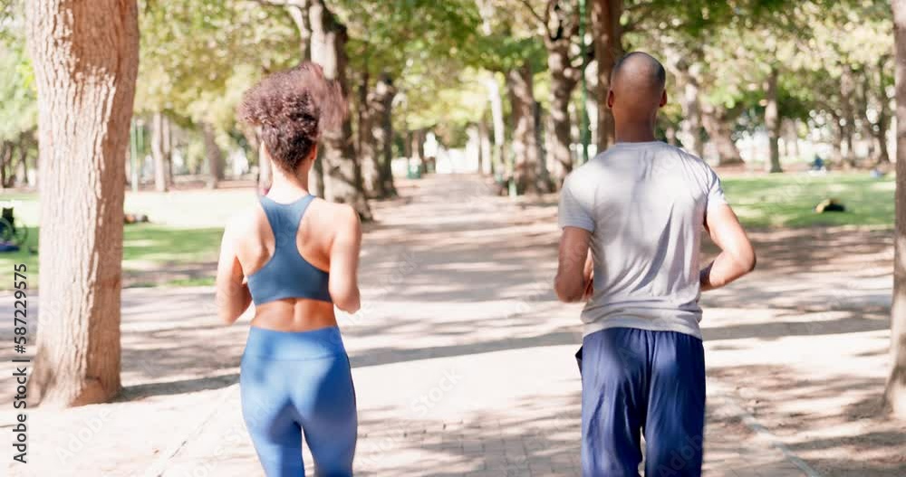 Fitness, running and couple in park from back for exercise and bonding in nature together. Marathon training, black man and woman run on garden path for health, wellness and workout with green trees.