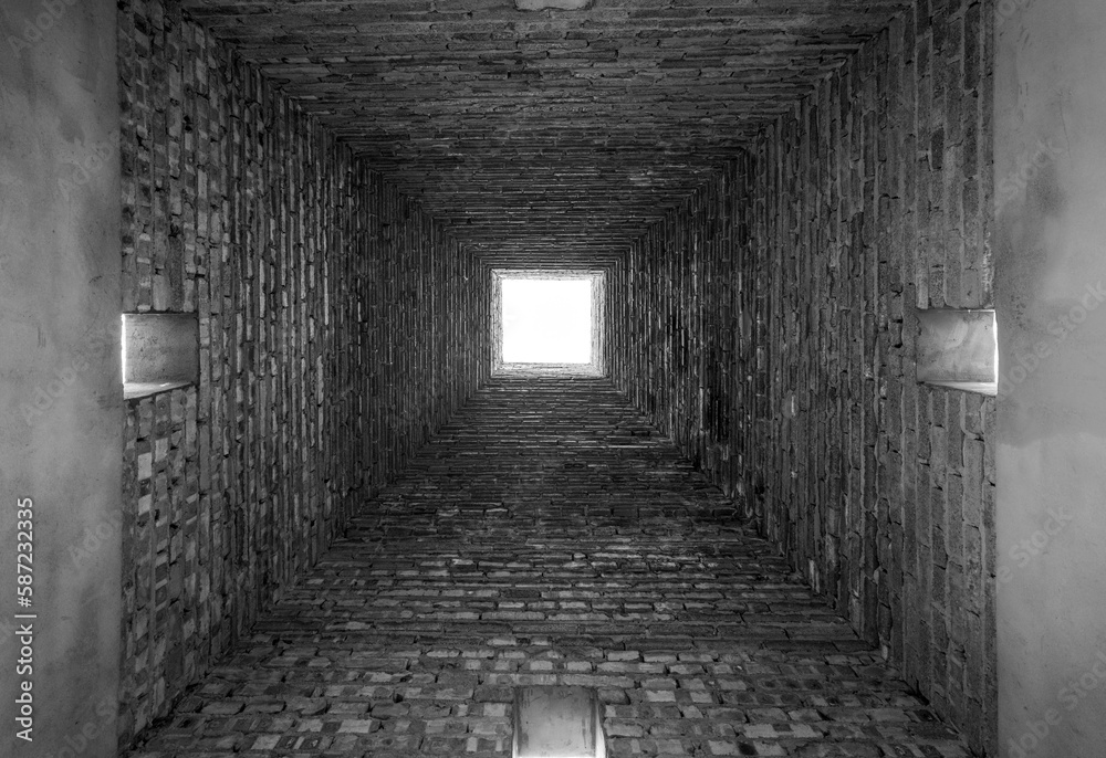 Fototapeta premium Brick empty small tunnel view, grayscale