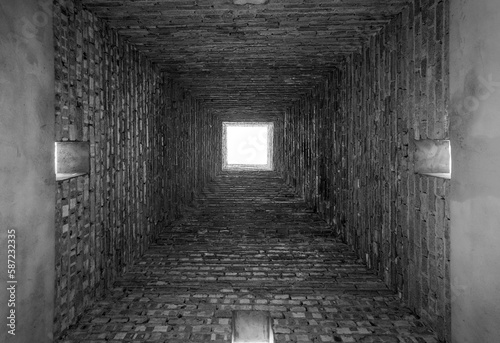 Brick empty small tunnel view  grayscale