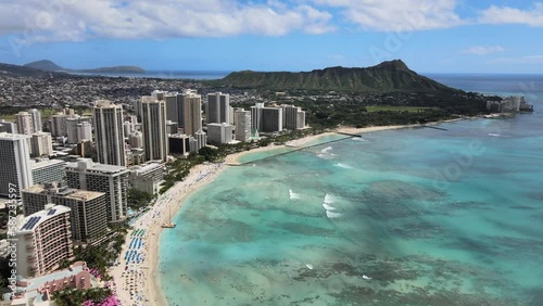 Aerial drone footage of Waikiki beach with Diamond Head monument during daytime in Hawaii