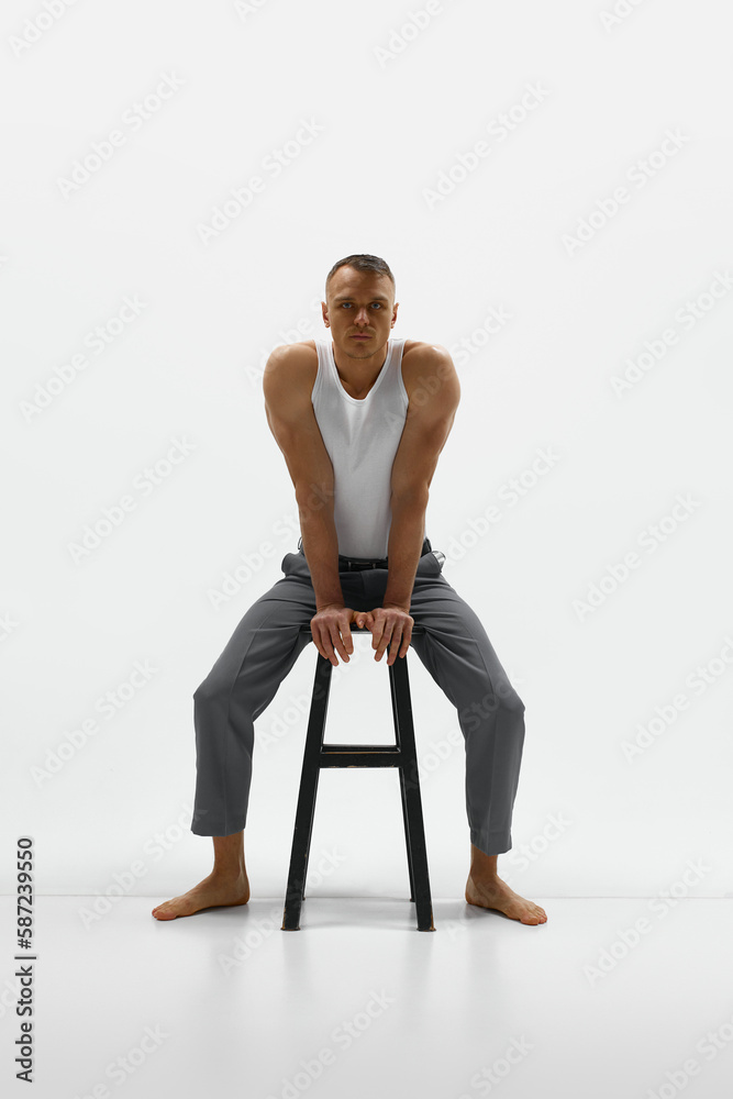Handsome stylish handsome young man posing over white studio background Handsome stylish handsome young man posing over white studio background