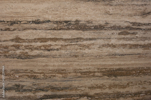 Travertine slab with brown horizontal texture