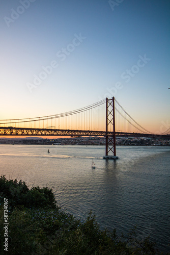 Beautiful view of the Ponte 25 de Abril suspension bridge in Portugal during sunset