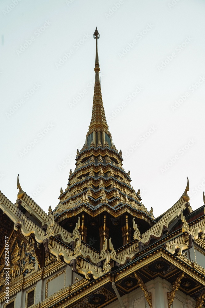 Vertical low-angle shot of the Chakri Maha Prasat Throne Hall castle in Bangkok, Thailand.