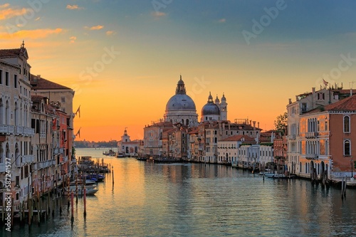 Scenic view of the Canal Grande in the town of Venice, Italy during sunset © Delfinophotography/Wirestock Creators