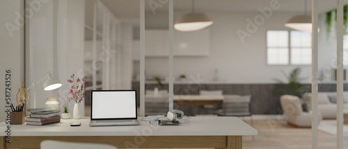 Fototapeta Naklejka Na Ścianę i Meble -  Modern white home office workspace with laptop mockup and accessories on table