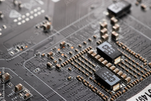 Detail of electronic components and microchips on a video card. Latest generation Video Card.