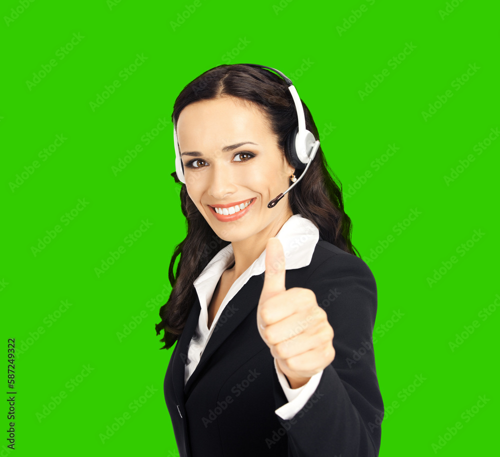 Call center service. Customer support phone sales operator in headset showing thumb up hand sign gesture, isolated on green chroma key chromakey background. Call center service. Customer support phone sales operator in headset showing thumb up hand sign gesture, isolated on green chroma key chromakey background.