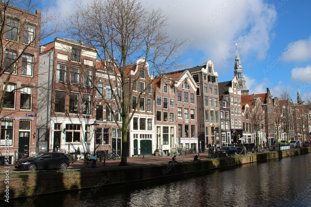 old brick houses and canal in amsterdam (the netherlands) 