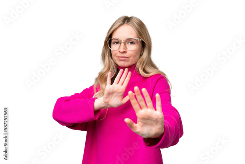 Young English woman over isolated background nervous stretching hands to the front