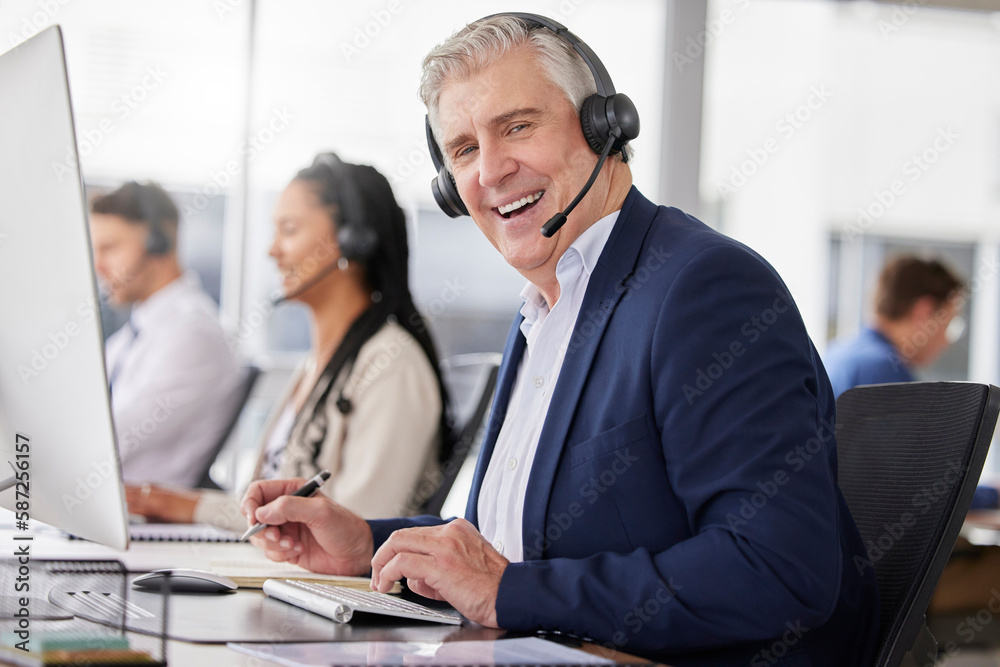 Portrait, laughing and man in call center in office working on customer service in workplace. Telemarketing, mature person and funny sales agent, consultant and telemarketer writing information. Portrait, laughing and man in call center in office working on customer service in workplace. Telemarketing, mature person and funny sales agent, consultant and telemarketer writing information.