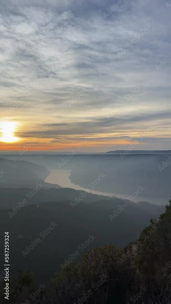 sunset from the top of a mountain, with a warm light and clear sky, illuminating the water of the river on a summer afternoon sunset from the top of a mountain, with a warm light and clear sky, illuminating the water of the river on a summer afternoon